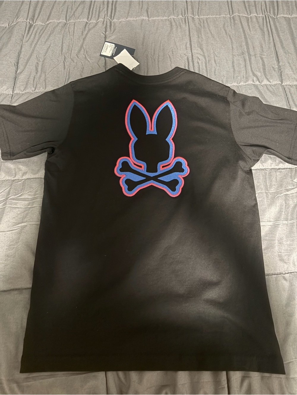 Psycho Bunny Black Tee with Blue and Red Outlined Bunny Skull